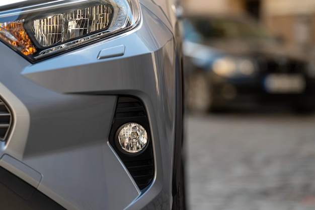 Closeup detail on headlight of modern car part of the front bumper