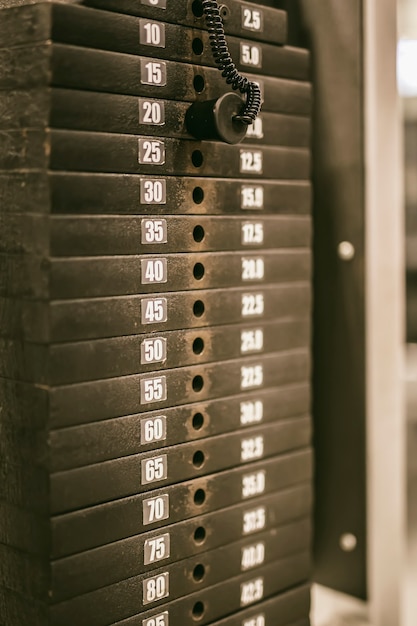 Closeup detail of the weight plates stack in the gym