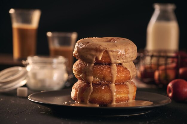 Closeup of donuts in stack with milk bottle and glass