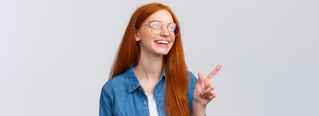 Photo closeup dreamy and cheerful excited redhead female in glasses dreaming about future opportunities as