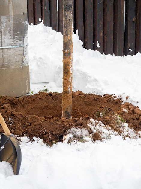 Closeup drilling of a well or well in the ground using a special installation Digging a well earth sand