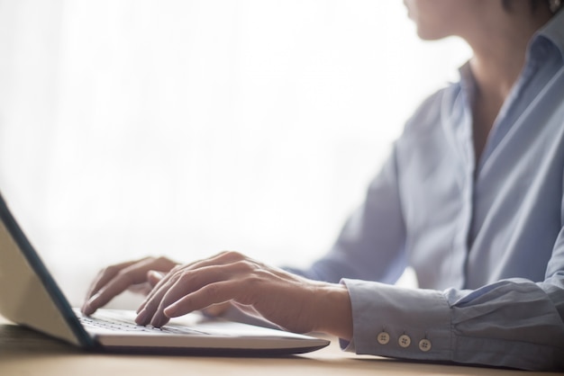 Closeup of Employee Typing on Laptop Computer