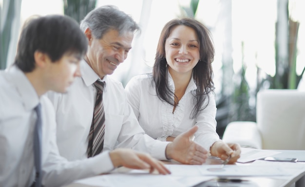 Closeup employees working with documents in office