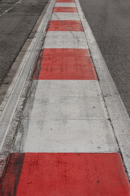 Closeup of the empty asphalt of an international race track Race track of a car motorcycle