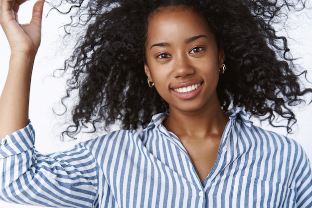 Closeup female fashion lifestyle blogger playing haircut checking hair smiling broadly looking confident sassy grinning joyfully having fun walking exploring downtown coffee shops white background