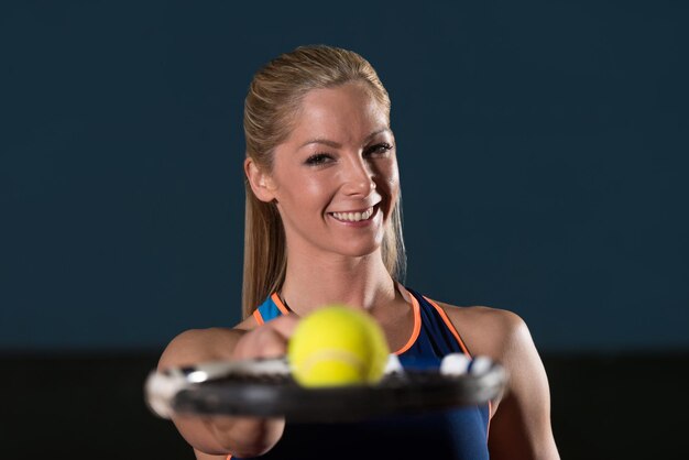 Closeup On Female Tennis Player Holding Racket With Ball