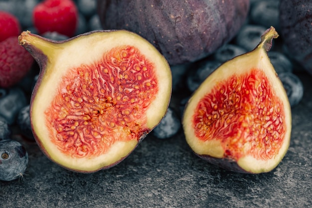 Closeup fig fruit on a blurred dark background