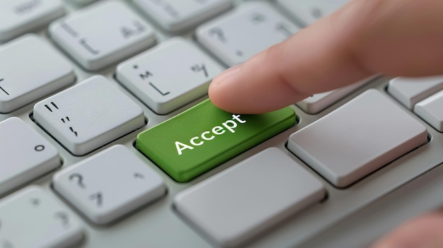 Closeup of a finger pressing the Accept button on a keyboard symbolizing online agreement or con