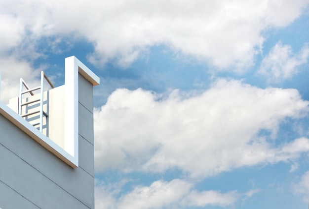 Closeup fire escape of building with blue sky white cloud nature background