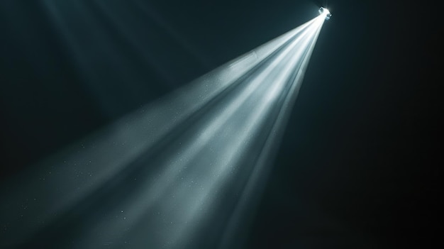 Photo closeup of a focused light beam cutting through darkness on black