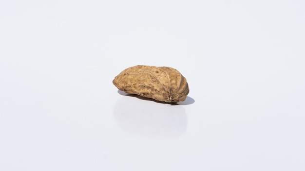 CloseUp of Fresh Peanut with Rich Textures Resting on a Clean White Background