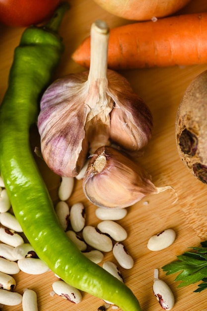 Closeup of fresh vegetables on a wooden cutting board