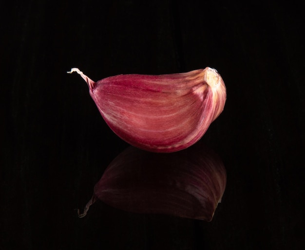 Closeup Garlic clove with black background