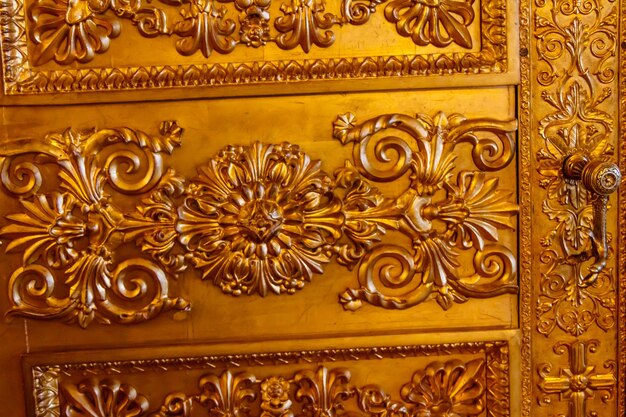 Closeup of a gilded ornate door