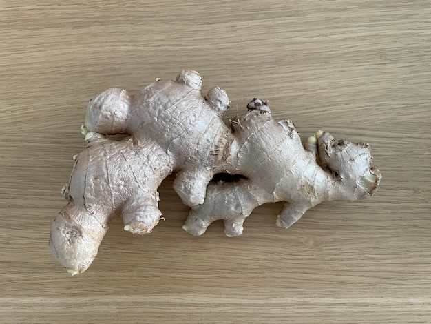 Closeup ginger isolated on wooden background