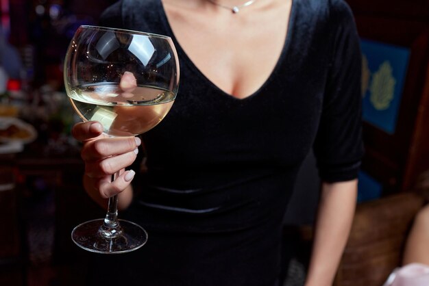 Closeup of gorgeous woman with a glass of champagne party and holiday celebration