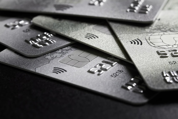 Closeup of a group of bank credit cards on dark background