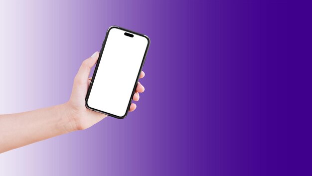 Closeup of hand holding smartphone with blank on screen isolated on background of violet