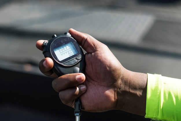 Closeup of hand holding stopwatch