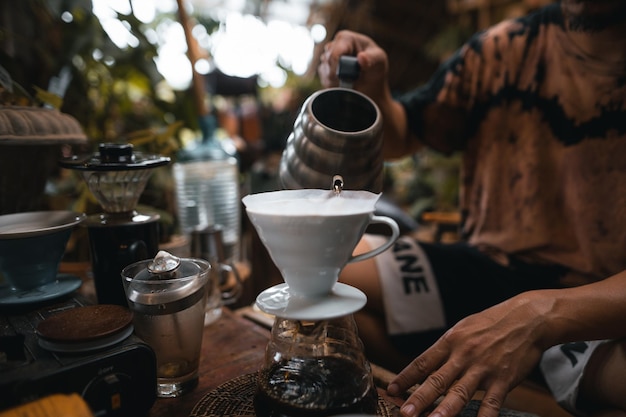 Closeup of hands barista make coffee