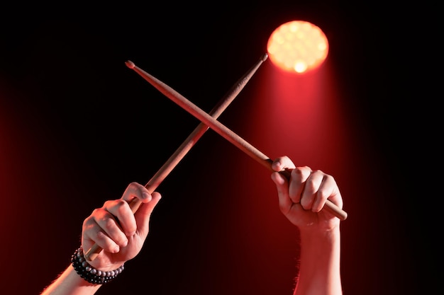 Closeup of the hands of a drummer who beats out the rhythm