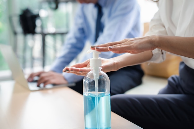 Closeup  hands using alcohol gel for sanitizer anti virus bacteria.