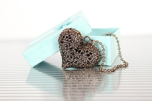 Closeup of a heart necklace in a gift box