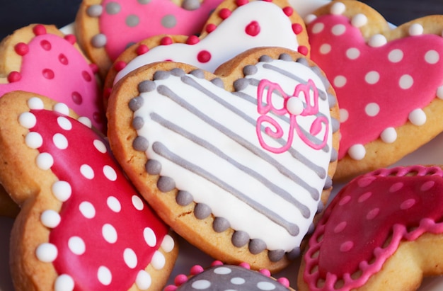 Closeup of heart shaped with different patterned royal icing cookies for Valentine's day