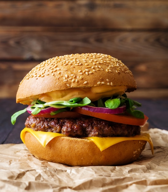 Closeup of home made burger on wooden