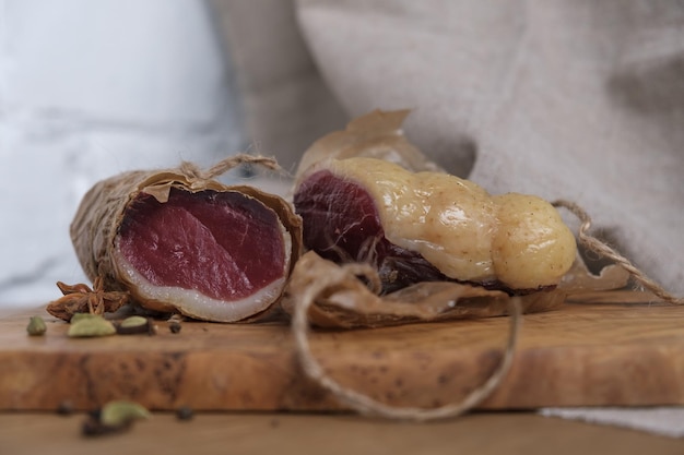 Closeup homemade duck jamon homemade snack jerky on board selective focus