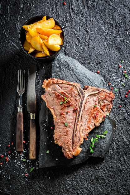 Closeup of homemade tbone steak and chips