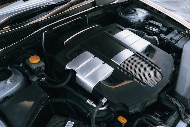 A Closeup of the Horizontally Opposed 6Cylinder Boxer Engine Under the Hood Revealing the Clean and Powerful Motor Block of a Sports Car The engine under the hood