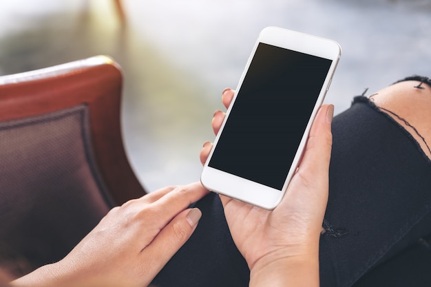 Closeup image of a hand holding a smart phone