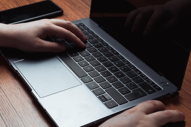 Closeup image of hands typing on laptop. Business and finance concept. Technology keyboard