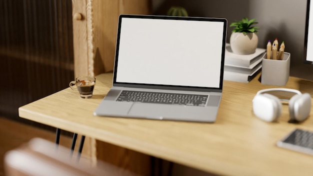 Closeup image of minimal workspace with laptop mockup and decor on wood table