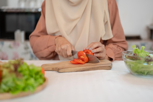 Closeup image of a Muslim woman is cooking in the kitchen Culinary leisure lifestyle