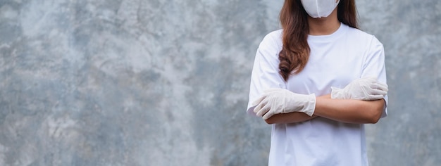 Closeup image of a woman wearing protective face mask and medical rubber gloves for Health care and Covid19 concept