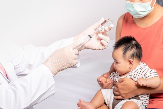 Closeup images Doctor's hand which prepares to vaccinate against virus