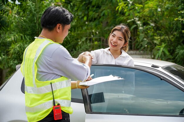 Closeup insurance company officers are congratulatory handshake with customer after completing the insurance claim