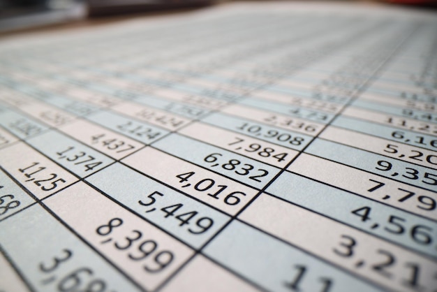 Closeup of investigation papers with columns of digits on table accounting statistics and audit