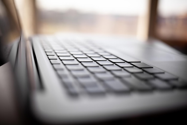 Closeup of the keyboard of an open laptop ready to work