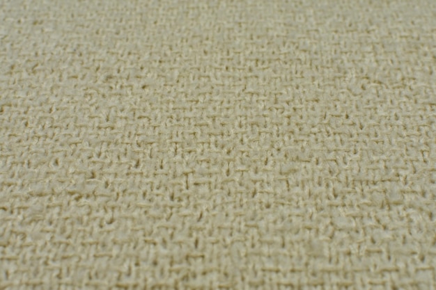 Closeup of knitted beige woolen texture