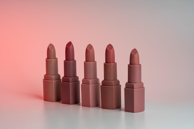 Closeup of Lipsticks With Different Colorful Tones In A Row