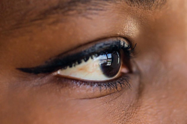 Closeup of makeup eye with long eyelashes of african american woman