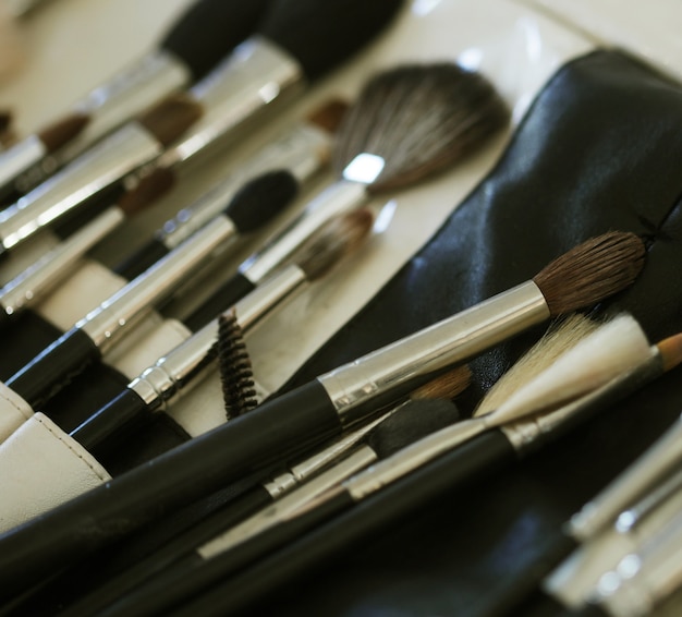 Closeup of makeup tools in their holder