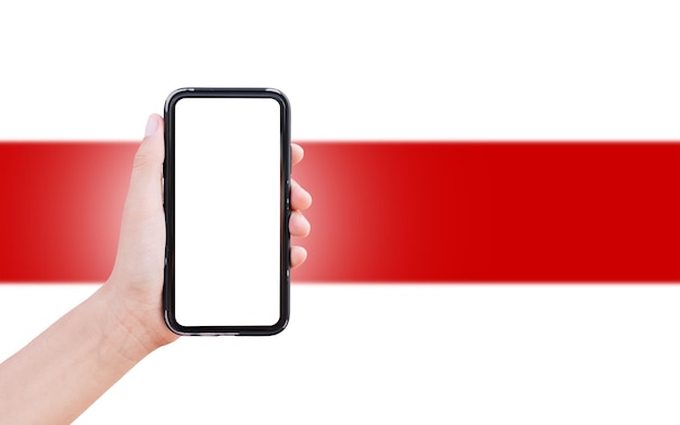 Closeup of male hand holding smartphone with blank on screen on background of blurred flag of Belarus