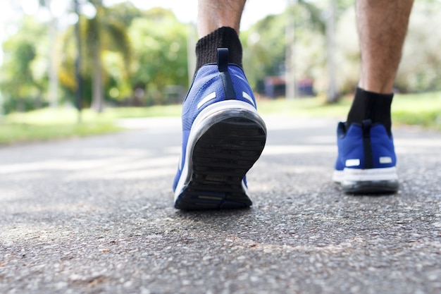 Closeup of male running walking shoes