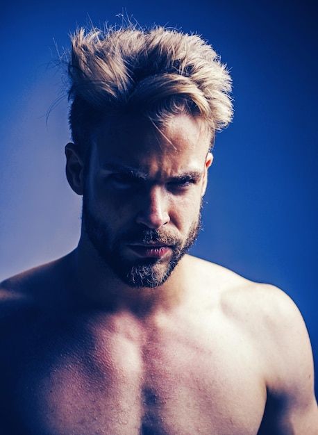 Closeup man portrait Man face Handsome bearded man face half on grey background Sad and stress man H