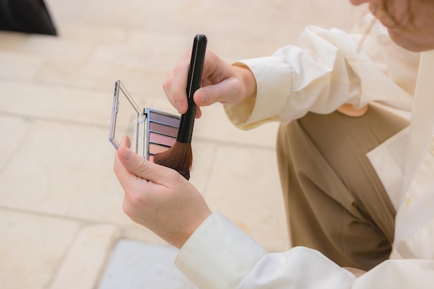 Closeup of a man with a makeup kit