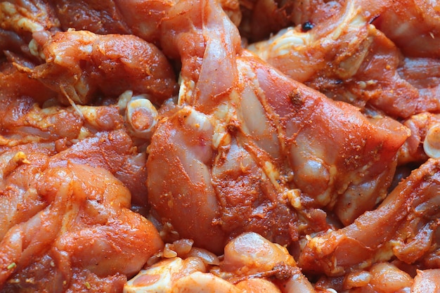 Closeup on marinating pieces of meat Cooking